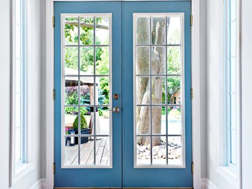 French-style alfresco doors of an Australian home, leading to their backyard