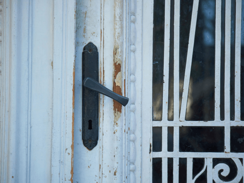 Rusty broken door knob white