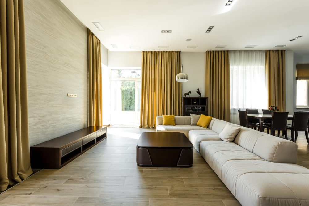 Modern lounge room with block out curtains and sheers layered.