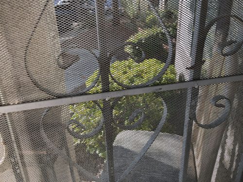 View of a security screen door mesh inside an Australian home.