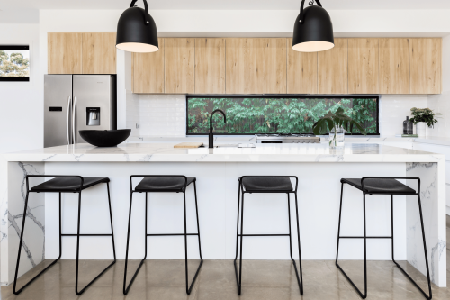 Modern kitchen with solid window splashback.