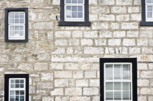 Various windows in different sizes on a wall